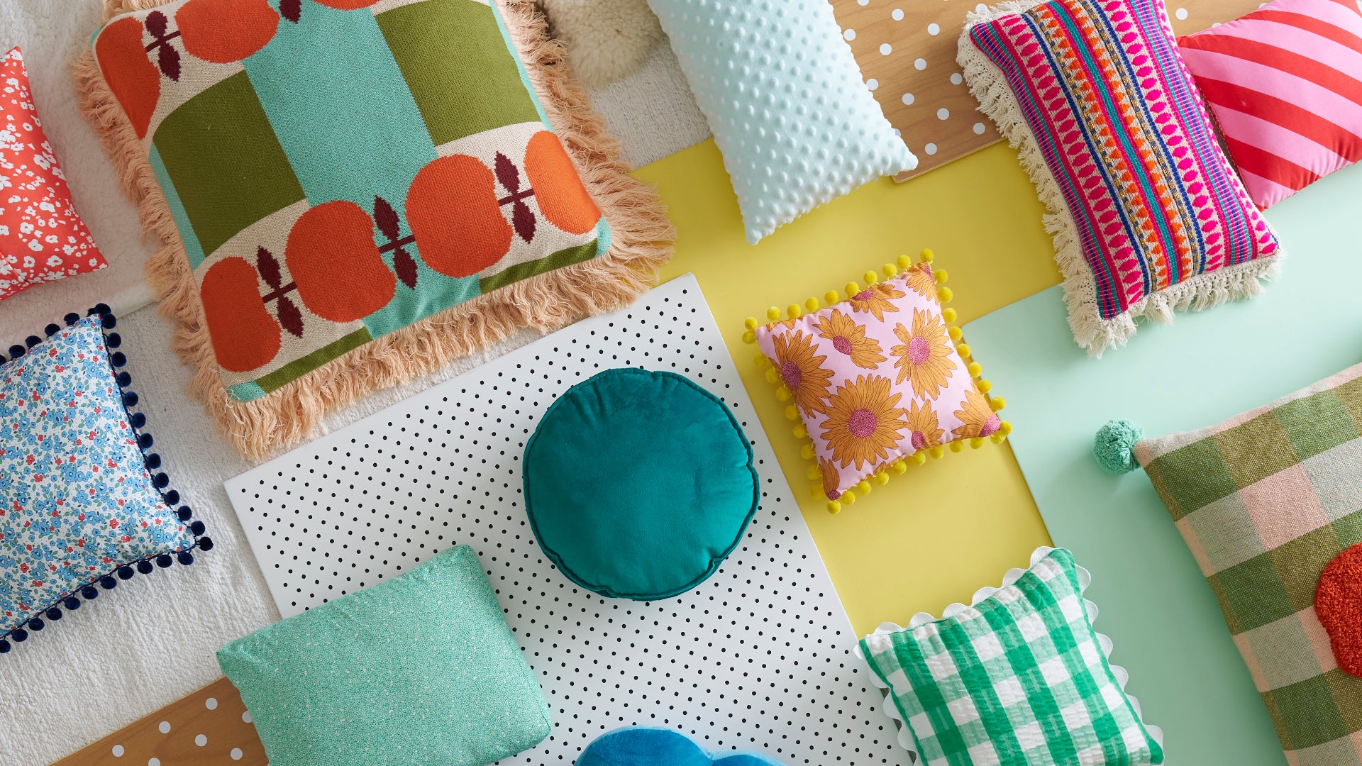 Overhead view of varying cushions with colourful patterns