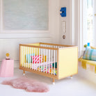 A cot with yellow end panels