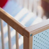 Corner detail of a beechwood cot